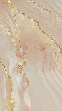 a close up of a pink and gold marble surface