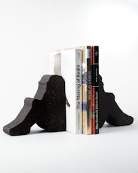 a pair of bookends on a white surface