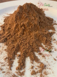 a pile of cocoa powder on a white plate