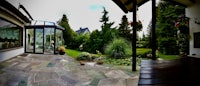 a 360 degree view of a garden and patio