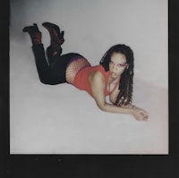 a woman laying on the floor in a polaroid