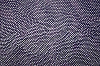 a close up image of a purple fabric with white dots