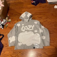 a gray hoodie with a cloud on it