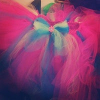 a pink and blue tutu with a bow on it