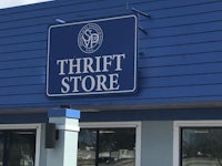 thrift store sign on the side of a building