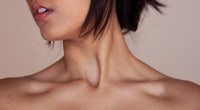 a close up of a woman's neck