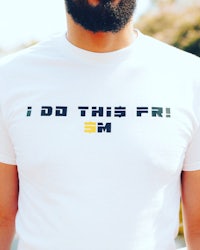 a man wearing a t - shirt that says i do this fri