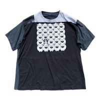 a black t - shirt with sheep on it