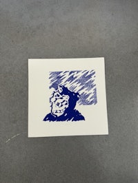 a drawing of a monkey on a piece of paper