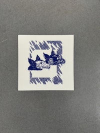 a blue and white sticker with two birds on it