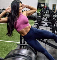 a woman posing in a gym