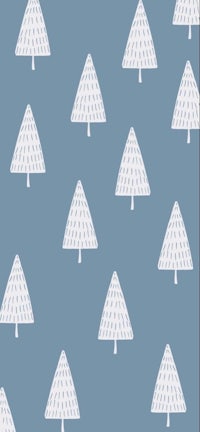 a white christmas tree pattern on a blue background