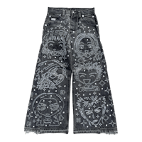 a pair of denim pants with embroidered designs on them