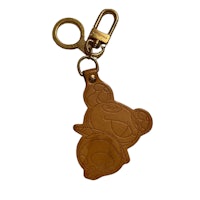 a brown keychain with a koala on it