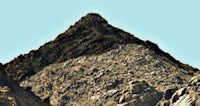 an image of a mountain with rocks on it