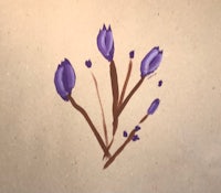 a drawing of purple flowers on a piece of paper