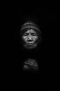 a black and white photo of an indigenous woman