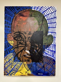 a painting of a man with a blue and yellow face