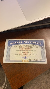a social security card is sitting on a desk