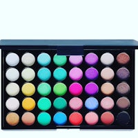 a colorful eyeshadow palette on a white background