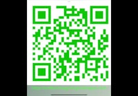 a green qr code on a phone screen