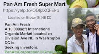 a man and woman are standing in front of a poster with the words pan fresh super market