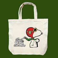 a tote bag with an image of snoopy wearing a helmet