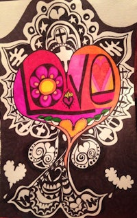 a drawing of a heart with the word love on it