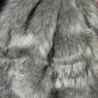 a close up of a grey fur coat