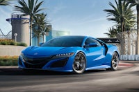 the 2020 acura nsx is driving down the road
