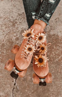 a pair of roller skates with flowers on them