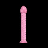 a pink sex toy on a black background