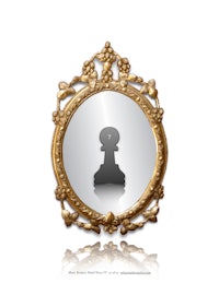 a mirror with a chess piece in it