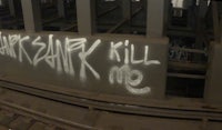 graffiti on the side of a subway car