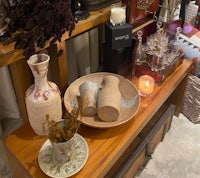 a table with vases and other items on it