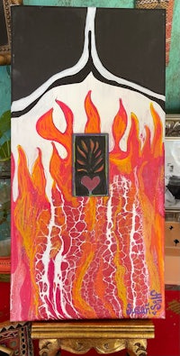 a painting of a heart with flames on it