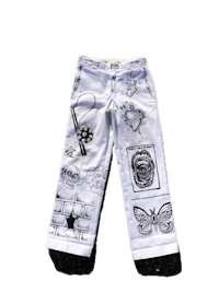 a pair of white pants with black and white designs on them