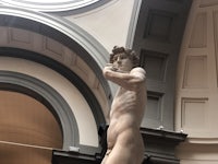 a statue of a man in a museum