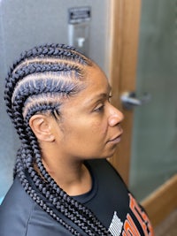 a woman with braids in her hair