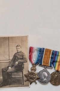wwii medals and a photo of a soldier