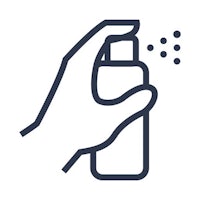 a hand holding a spray bottle