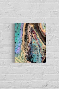 an abstract painting on a brick wall