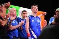 a group of boxers with an irish flag in front of them