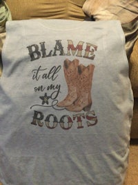 a t - shirt that says blame it all on my roots