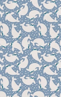 a blue fabric with white seals on it