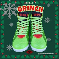 a pair of green basketball shoes with the word grinch on them