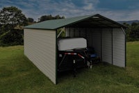 a metal carport with a trailer attached to it