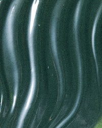 a close up of a green liquid paint