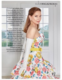 a woman in a floral dress is posing for a magazine
