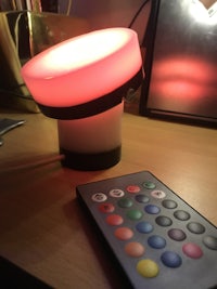 a table lamp with a remote control on it
